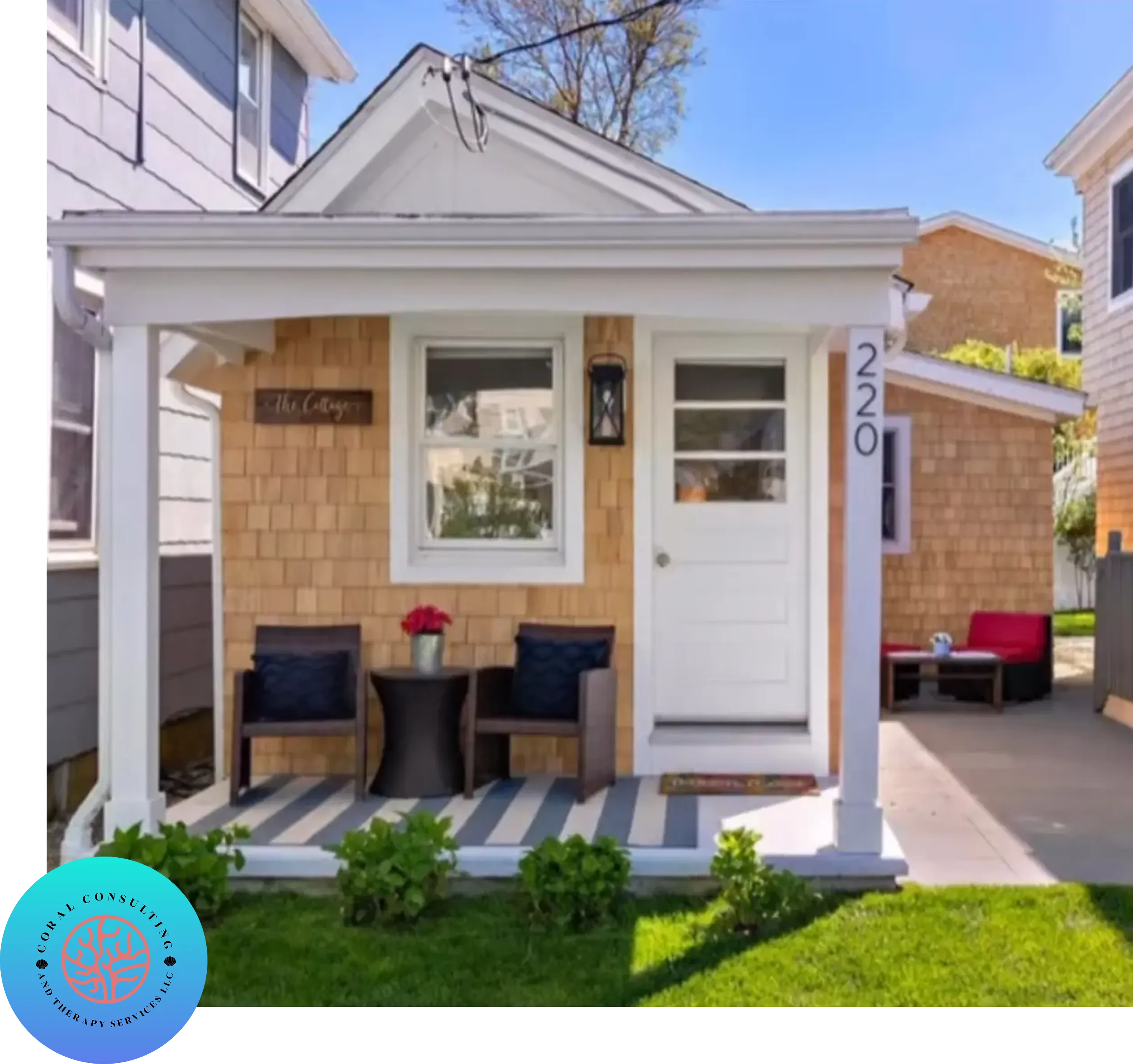 Cozy small house with a porch and two chairs.