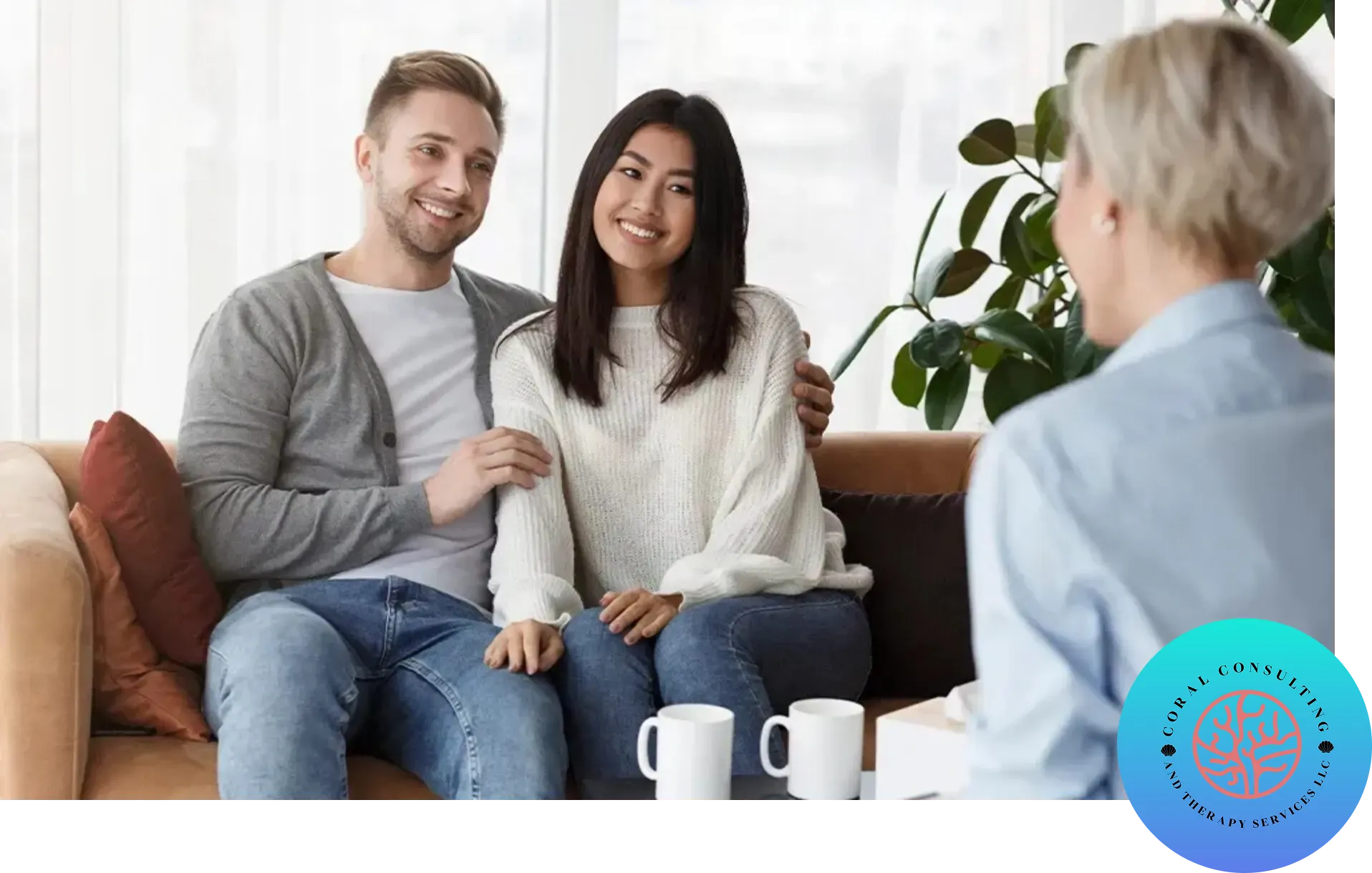Couple sitting on a couch during a counseling session.