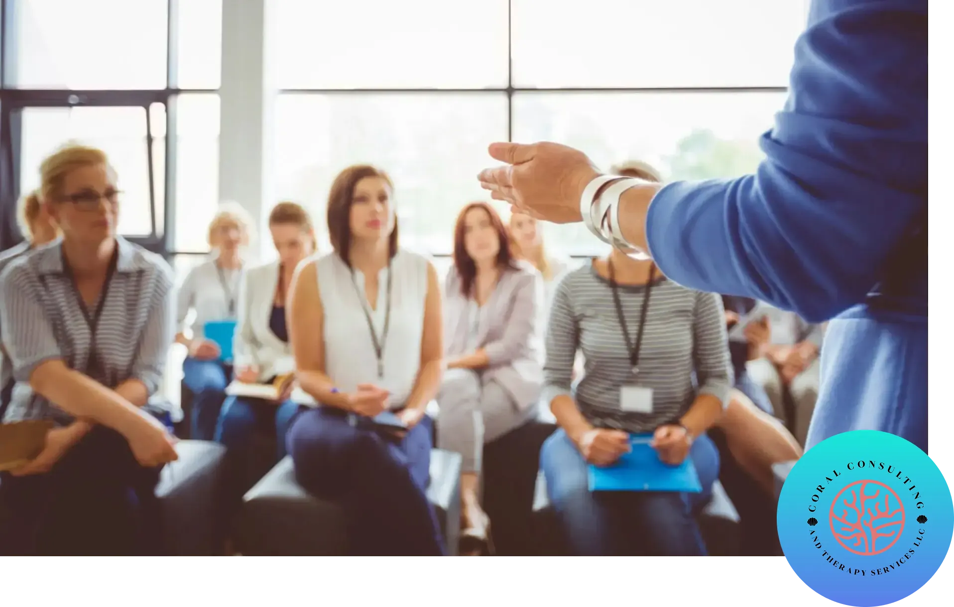 A speaker addressing an attentive audience at a seminar or workshop.
